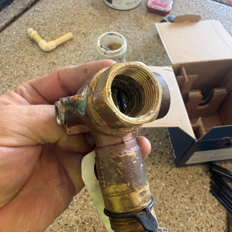 Tankless water heater service valve with corrosion damage Tankless water heater service valve with corrosion damage