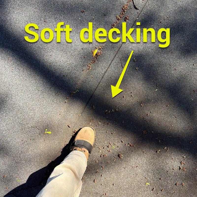 Soft decking material with debris and foot on roof