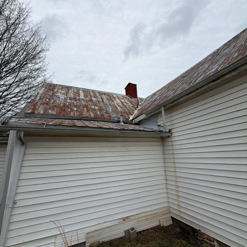 Metal roof with rust and weather damage