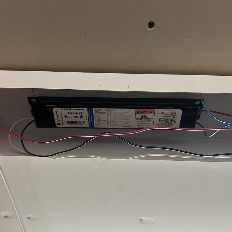 Lighting fixture ballast with wiring in ceiling panel Lighting fixture ballast with wiring in ceiling panel