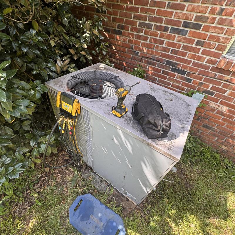 Heat pump package unit with tools on top outdoors