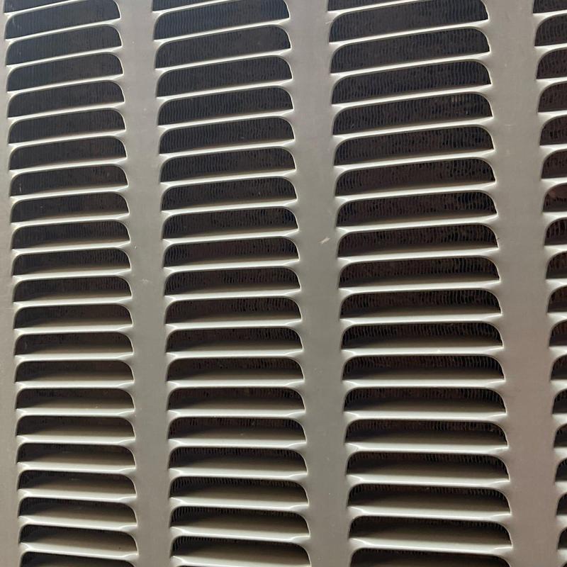 Outdoor air conditioner condenser grille close-up Outdoor air conditioner condenser grille close-up