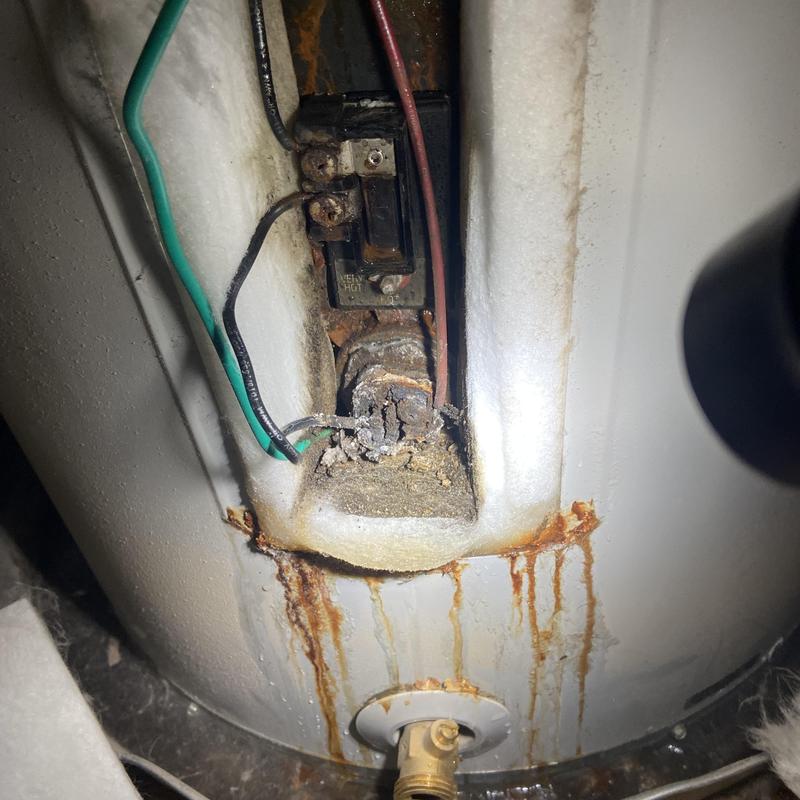 Water heater terminal block with corrosion and rust damage Water heater terminal block with corrosion and rust damage