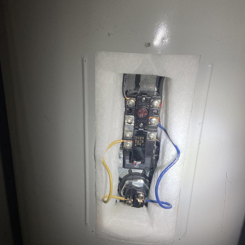 Water heater thermostat wiring and components close-up Water heater thermostat wiring and components close-up