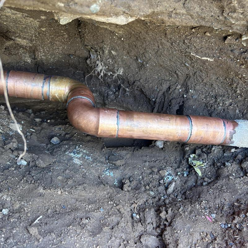 Type L copper water pipe with elbow fitting underground