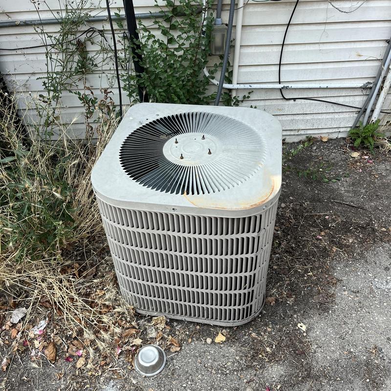 Outdoor air conditioner unit with damaged fan cover Outdoor air conditioner unit with damaged fan cover
