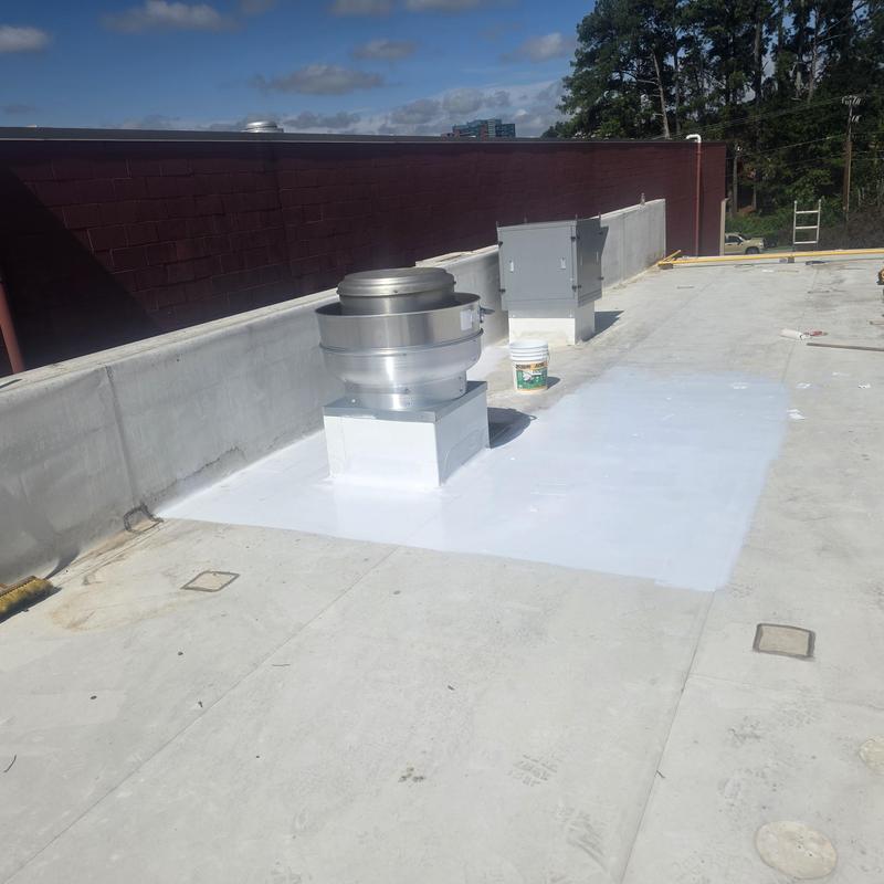 Silicone roof restoration area around ventilation system