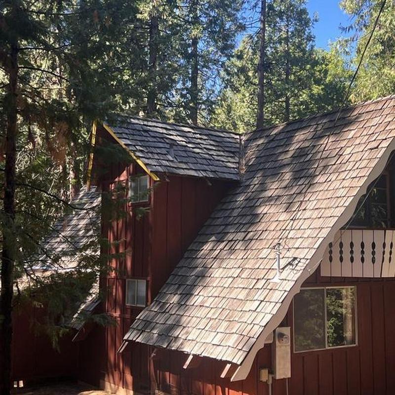 Wood shingle roof on forest cabin in Sonora, CA