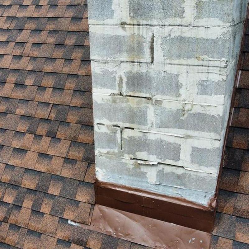 Chimney base flashing on shingle roof in Sonora, CA