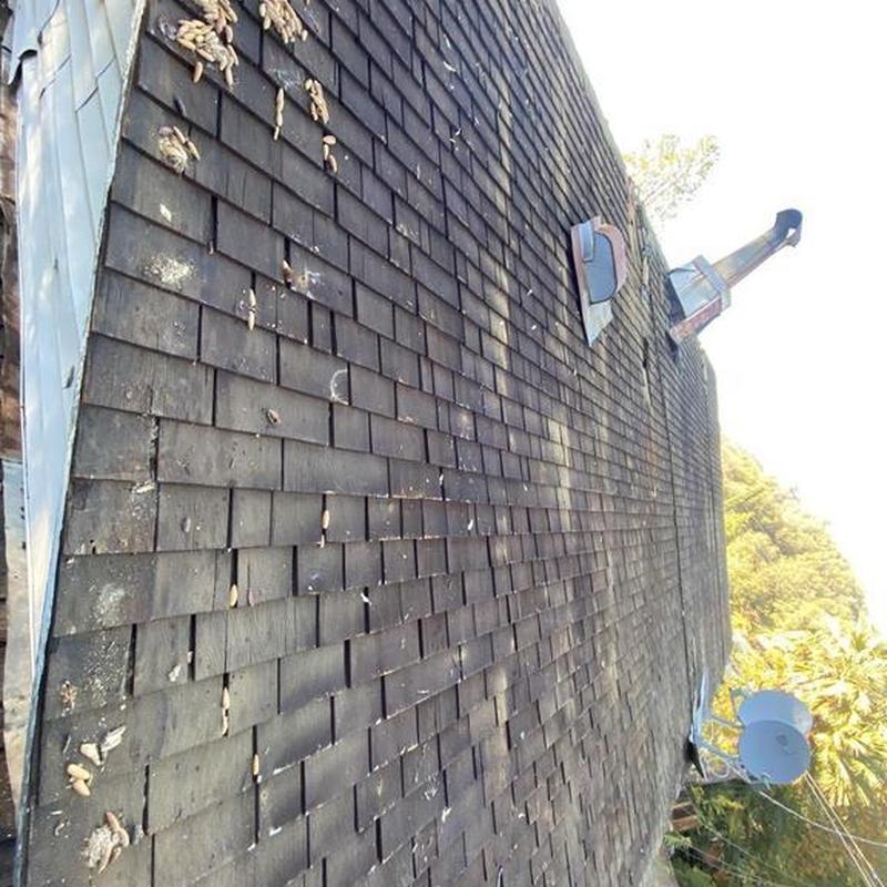 Wood shingle roof with dry rot damage in Sonora