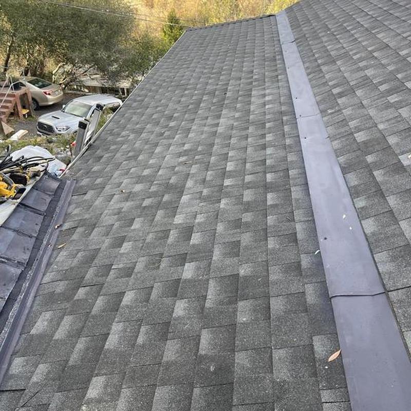 Asphalt shingle roof with metal ridge cap in Sonora