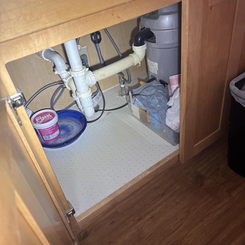 Kitchen sink drain piping and garbage disposal under cabinet Kitchen sink drain piping and garbage disposal under cabinet