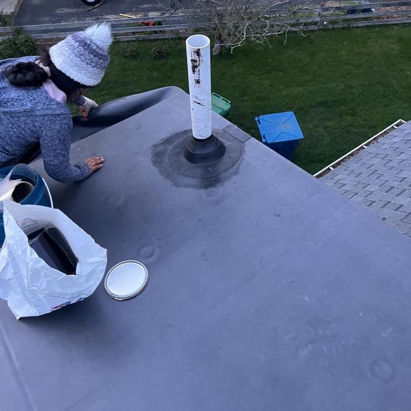 Rubber membrane roof with sealed vent pipe flashing Rubber membrane roof with sealed vent pipe flashing