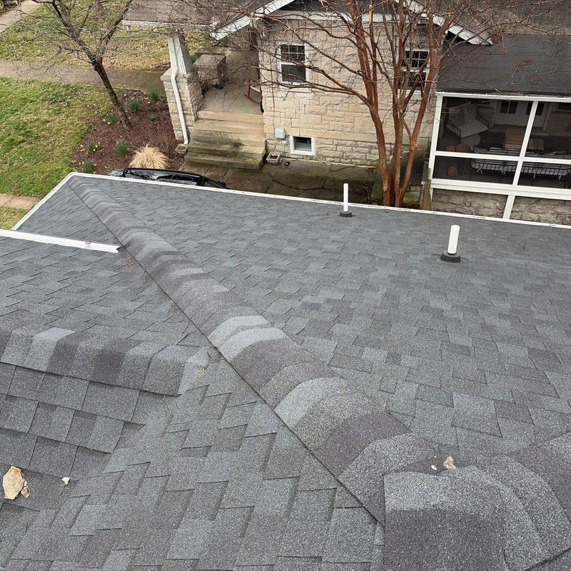 Asphalt shingle roof inspection with ridge vent and flashing