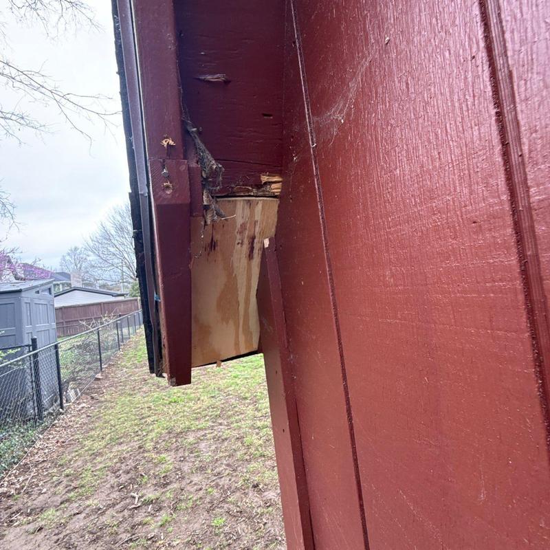 Wooden soffit with water damage and decay