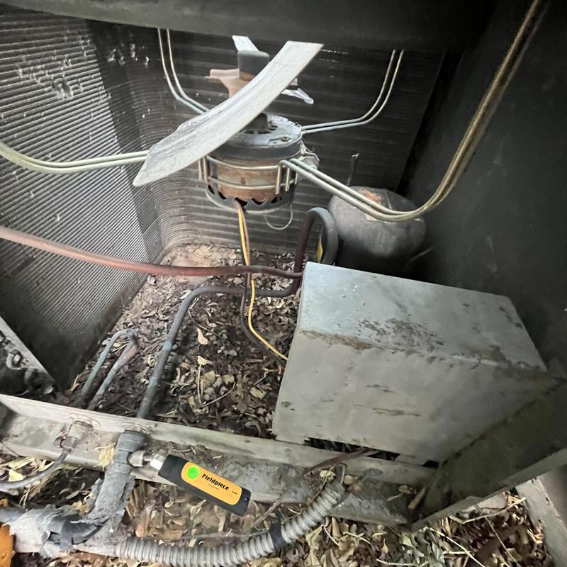1980s HVAC condenser coil and fan motor interior 1980s HVAC condenser coil and fan motor interior