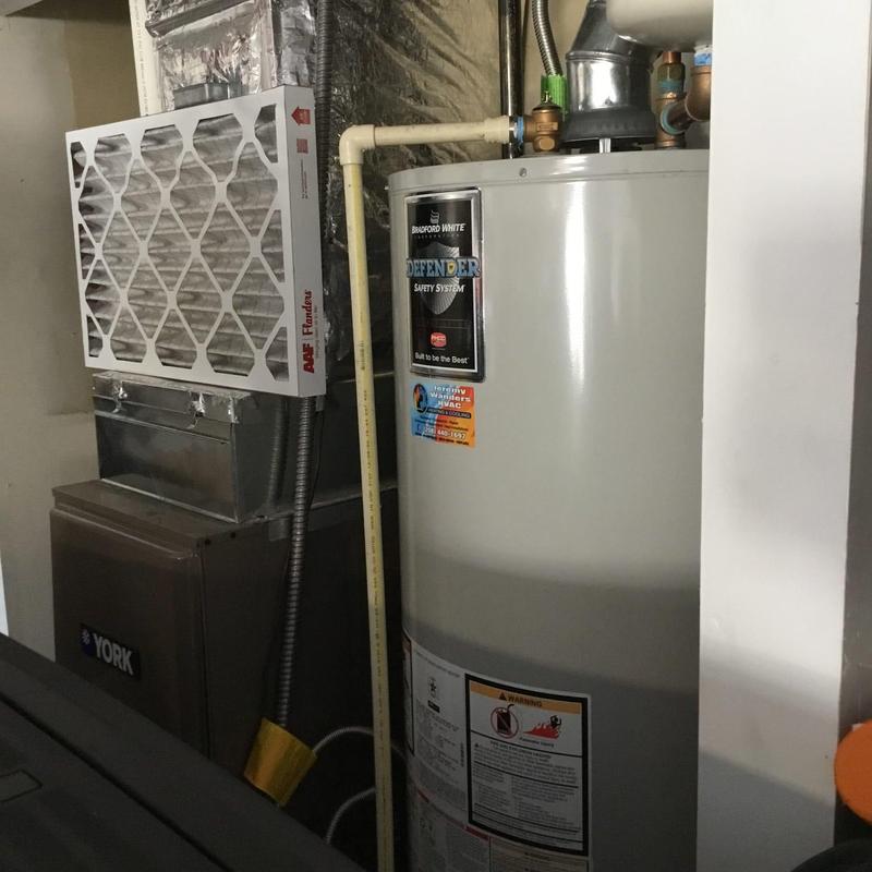 Water heater next to furnace in utility room Water heater next to furnace in utility room