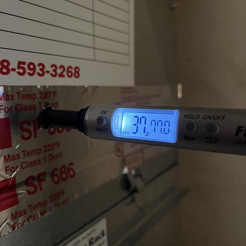 Digital HVAC moisture meter measuring duct humidity level Digital HVAC moisture meter measuring duct humidity level