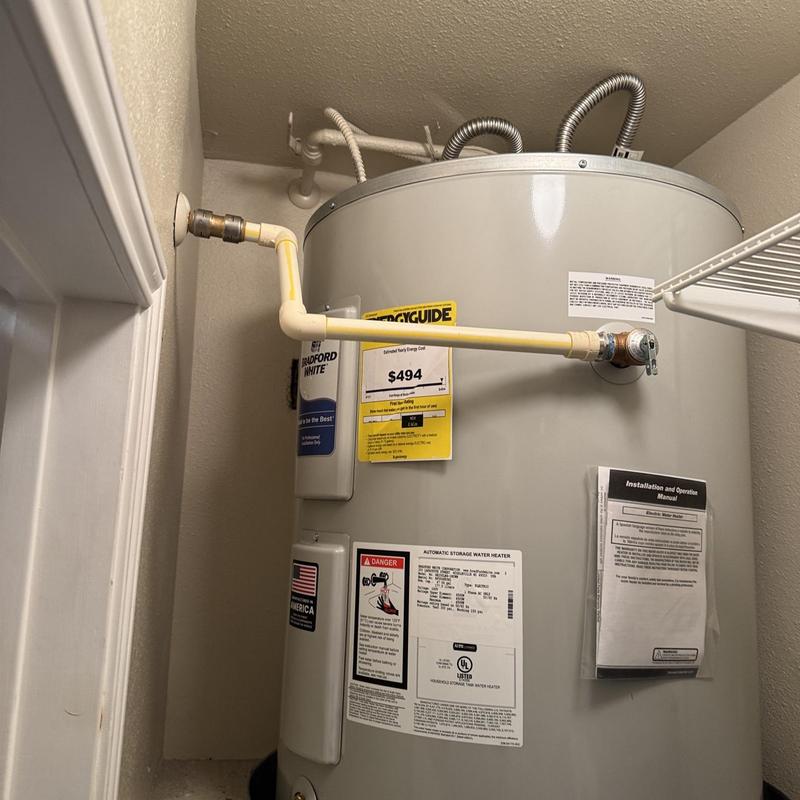 Electric water heater with new supply lines installed