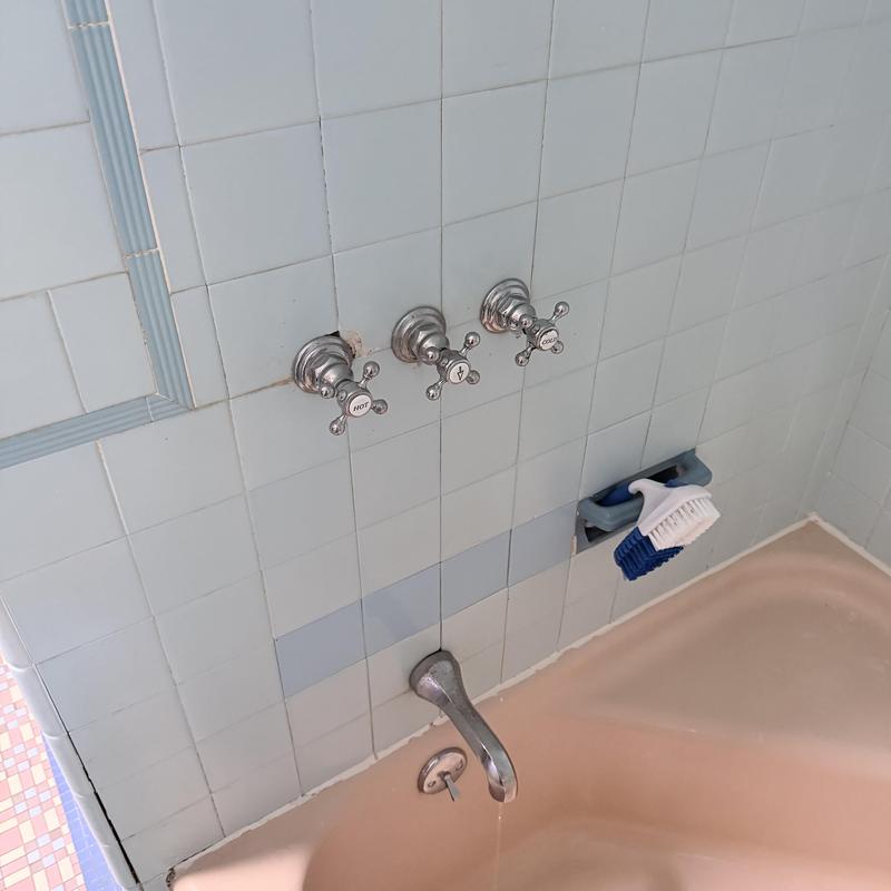 Shower valve and controls with tub and tiled wall Shower valve and controls with tub and tiled wall