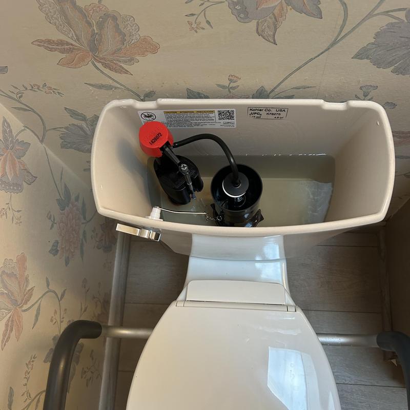 Toilet tank with fill valve and flush mechanism installation Toilet tank with fill valve and flush mechanism installation