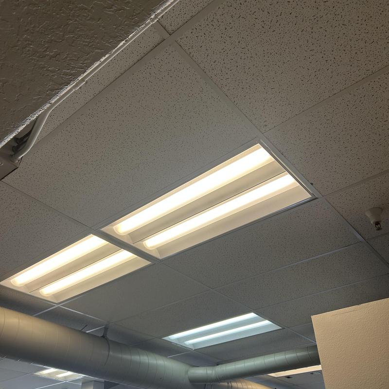 Fluorescent ceiling fixtures with ballasts in office ceiling