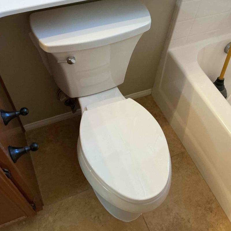 Kohler elongated ADA-compliant toilet installed in bathroom