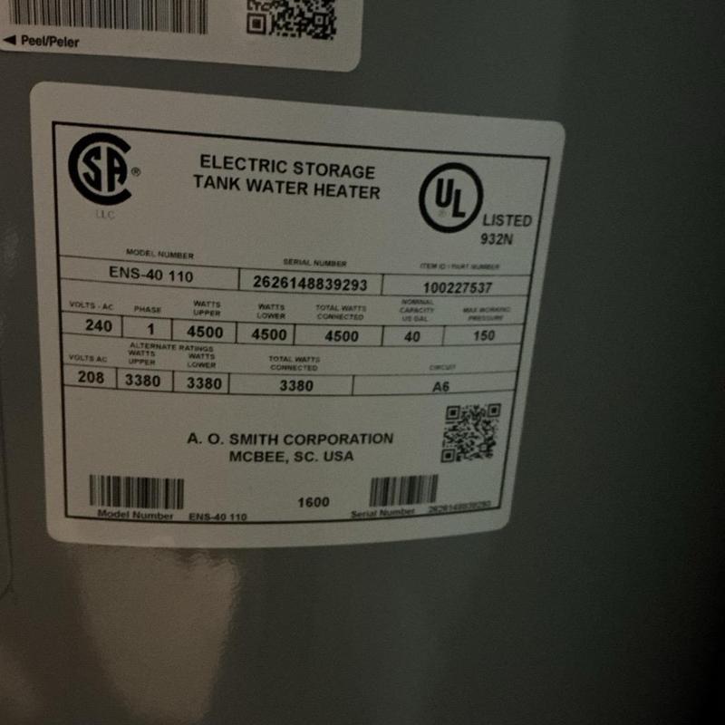 Electric storage tank water heater label close-up Electric storage tank water heater label close-up