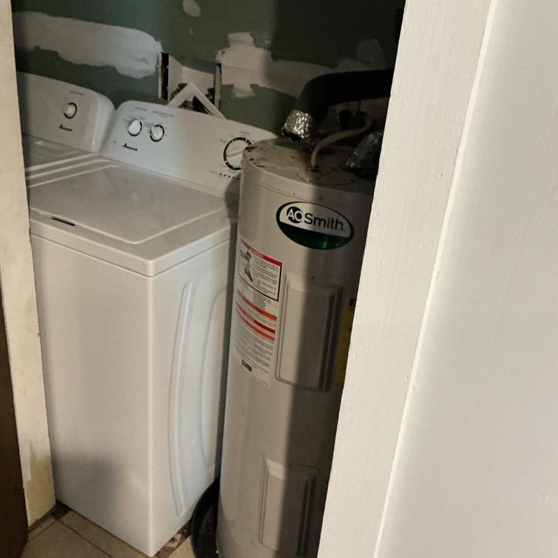 40-gallon water heater next to washing machine installation 40-gallon water heater next to washing machine installation
