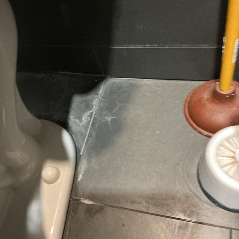 Toilet tank to bowl bolt tightened with socket wrench Toilet tank to bowl bolt tightened with socket wrench