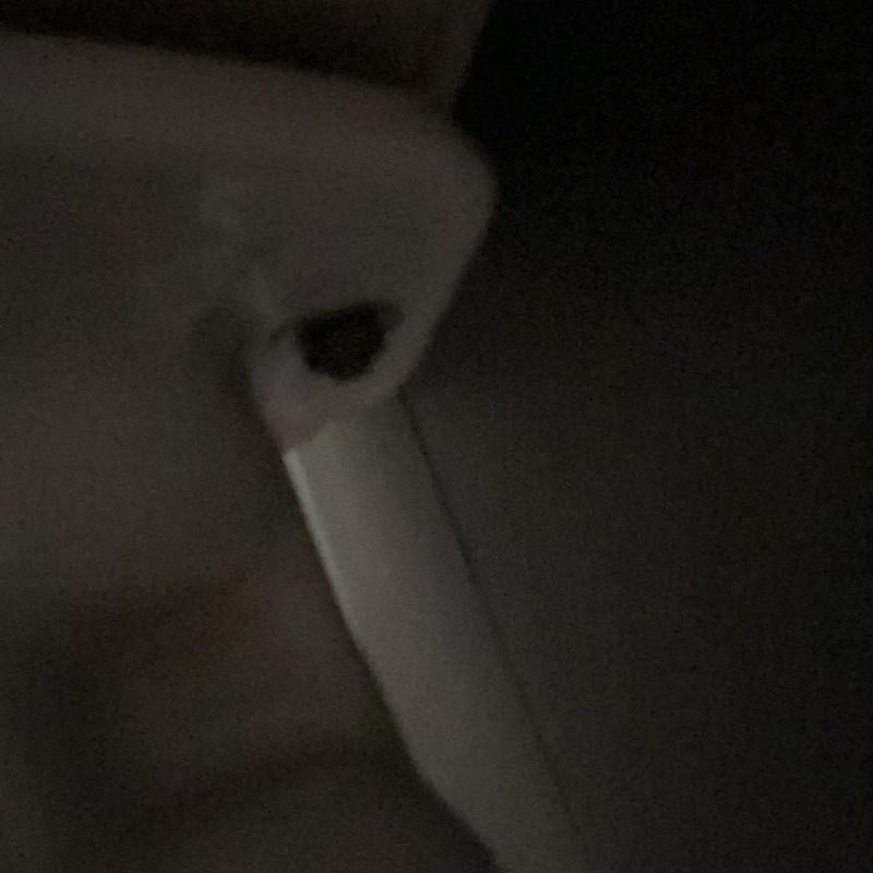 Toilet tank bolt with socket wrench in dark corner Toilet tank bolt with socket wrench in dark corner