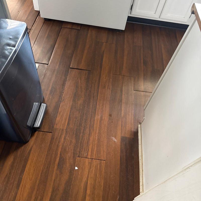 Laminate flooring gaps and warping near kitchen area