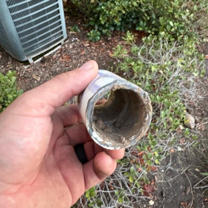 Underground water service pipe with corrosion buildup