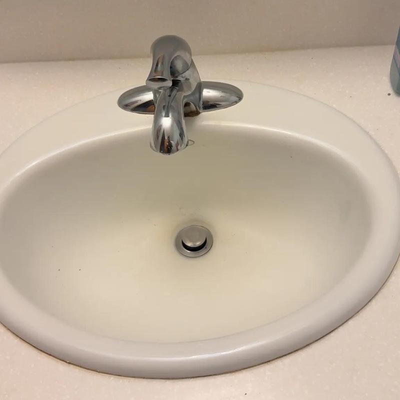 Bathroom faucet and white sink basin with countertop Bathroom faucet and white sink basin with countertop
