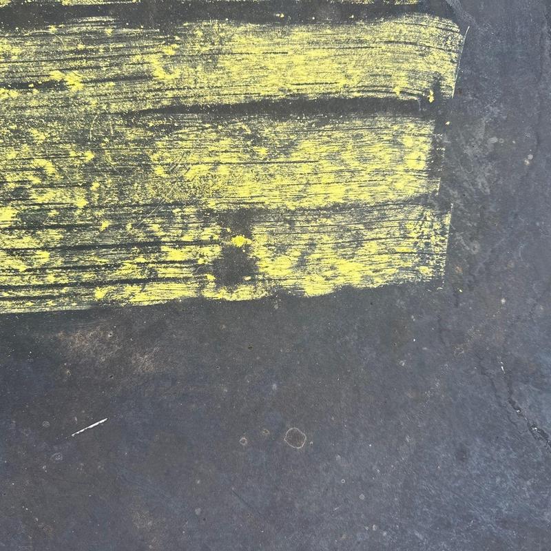 Commercial roof with hail damage and wear marks