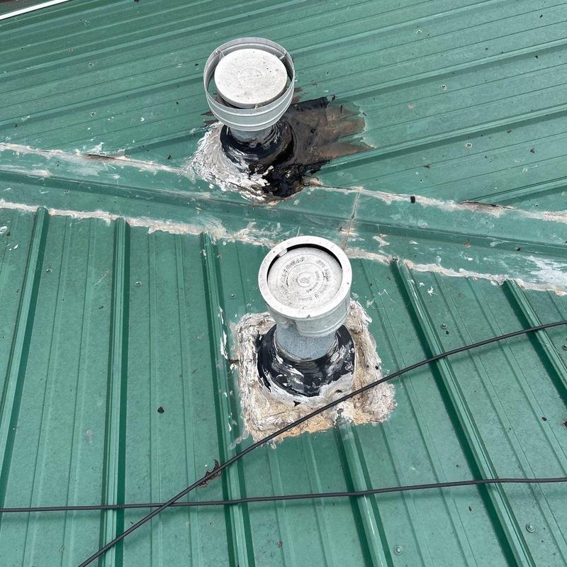 Metal roof vent pipe flashing with sealant on green roof