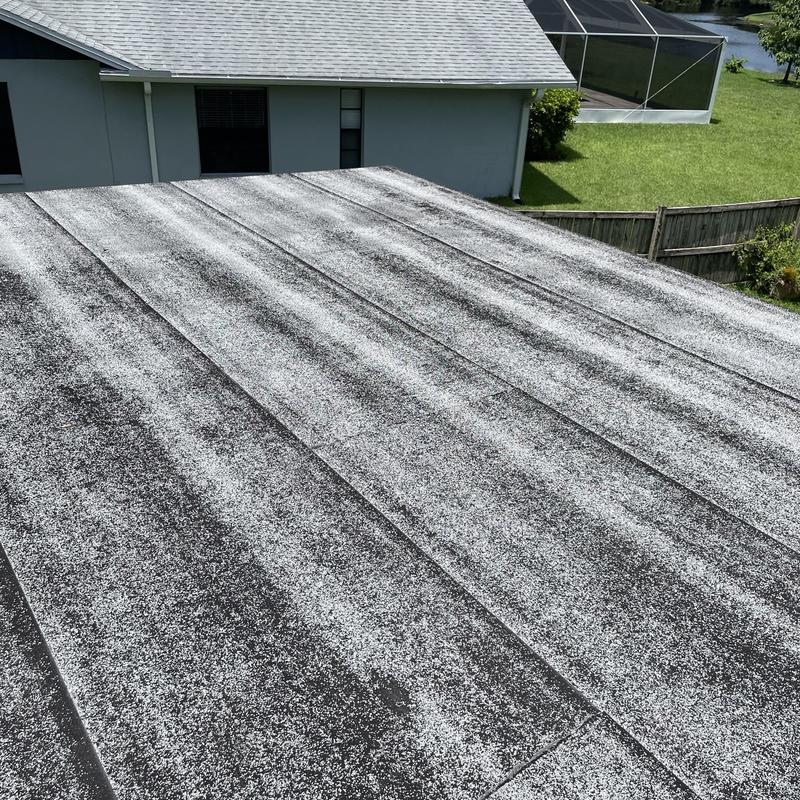 Flat roof surface with wear and granule loss
