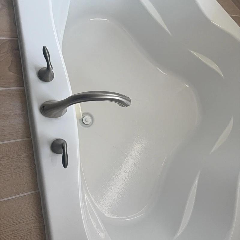 Roman tub faucet with hot and cold handles on tub edge Roman tub faucet with hot and cold handles on tub edge