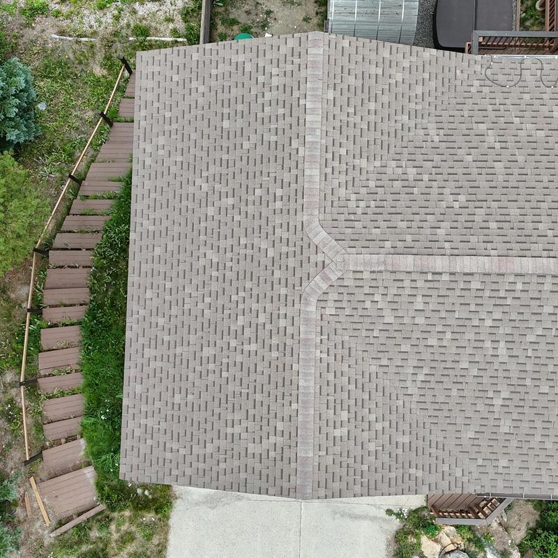 Asphalt shingle roof with ridge caps and walkways