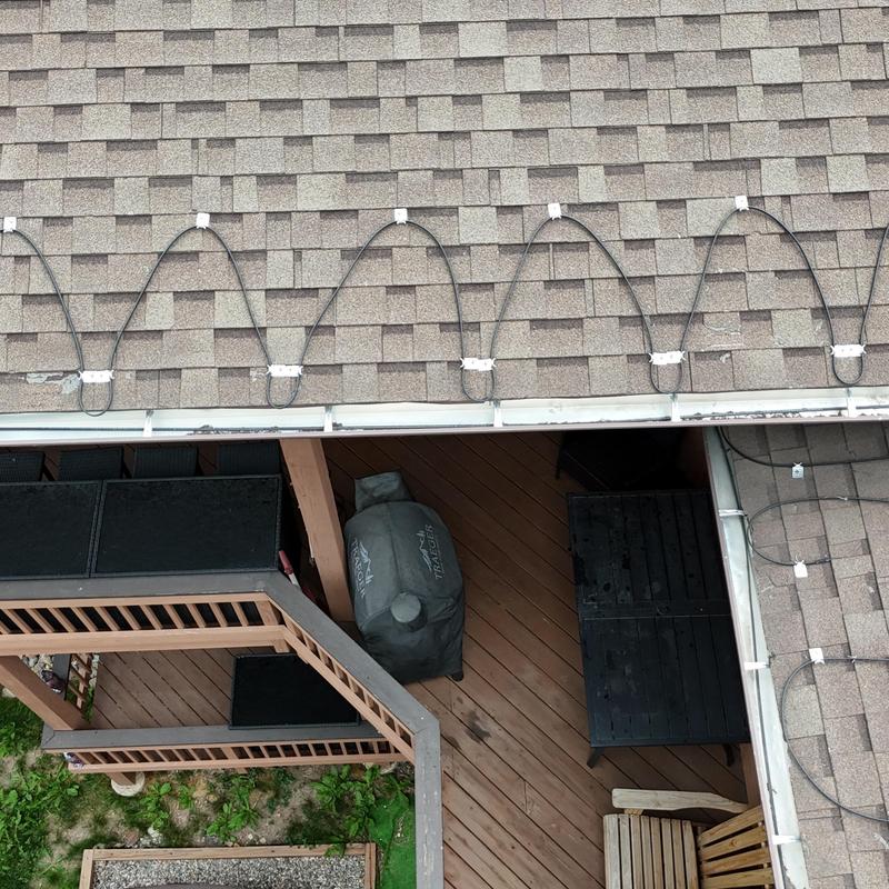 Asphalt roof with ice dam heat cables installed