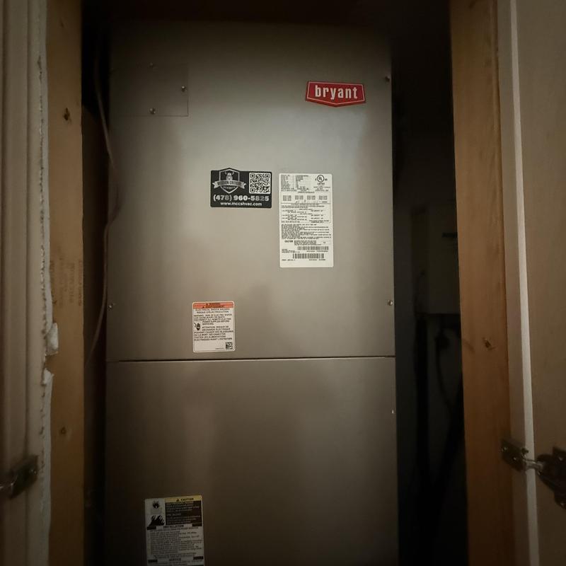 Bryant HVAC air handler unit in utility closet Bryant HVAC air handler unit in utility closet