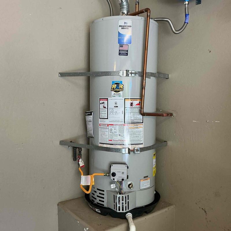 50-gallon water heater with copper piping and safety straps