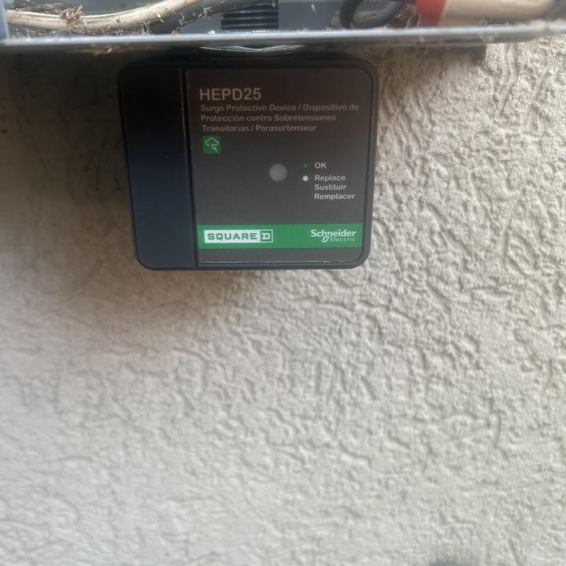 Surge protective device on textured exterior wall
