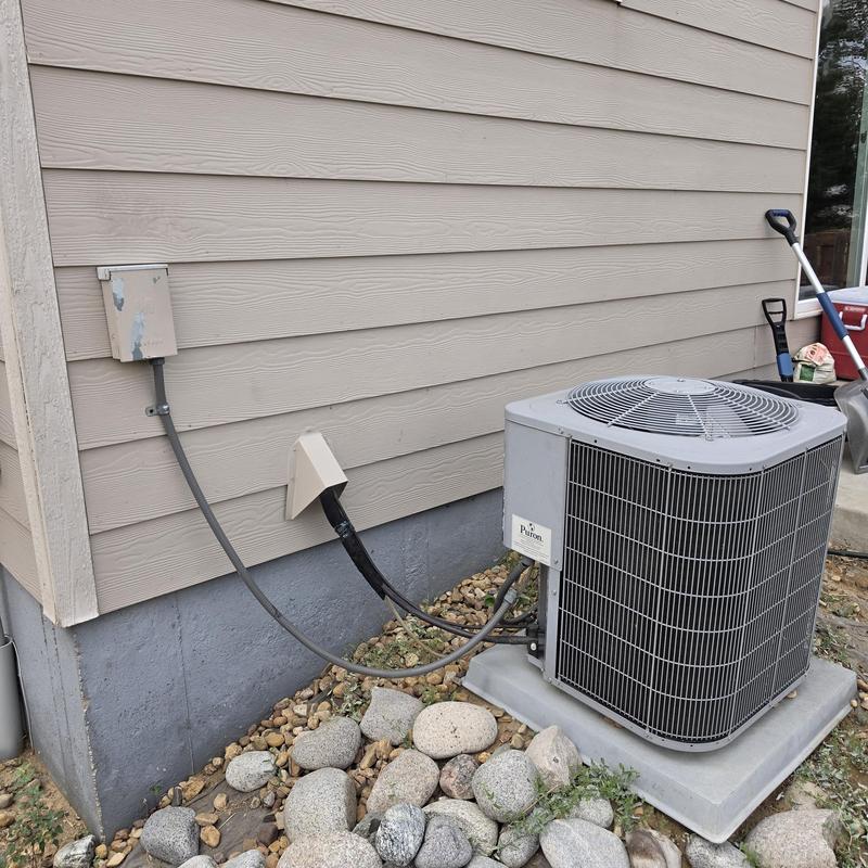 Carrier air conditioner unit outside home with rock bedding Carrier air conditioner unit outside home with rock bedding