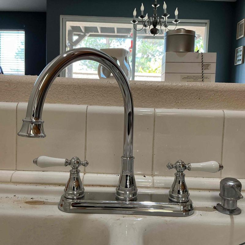 Kitchen faucet with dual handles on countertop