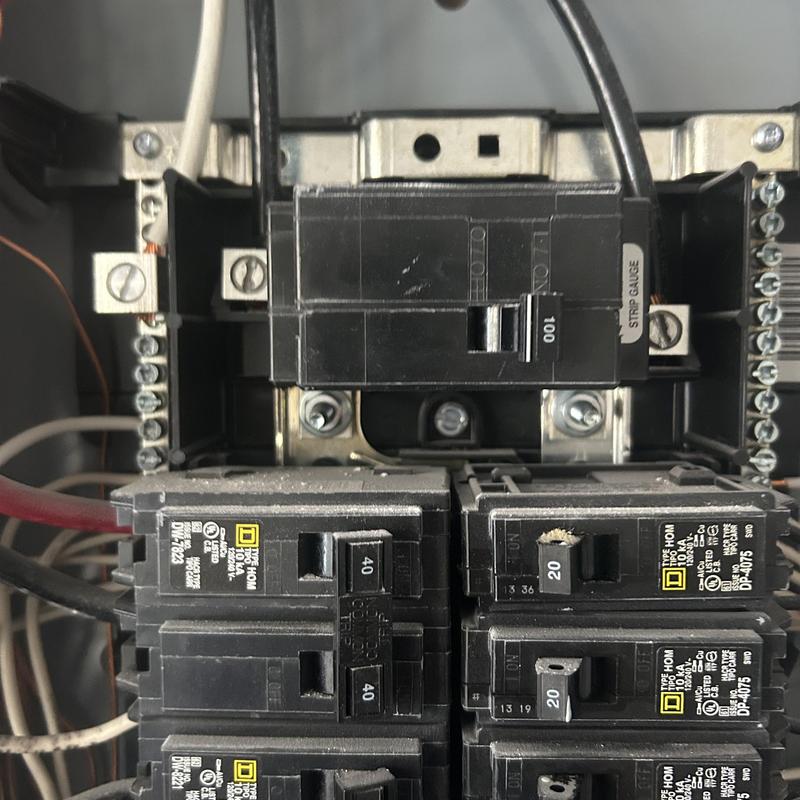 Main electrical service panel with circuit breakers and wiring Main electrical service panel with circuit breakers and wiring