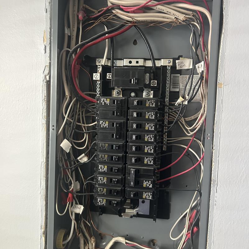 Main electrical service panel with circuit breakers and wiring Main electrical service panel with circuit breakers and wiring