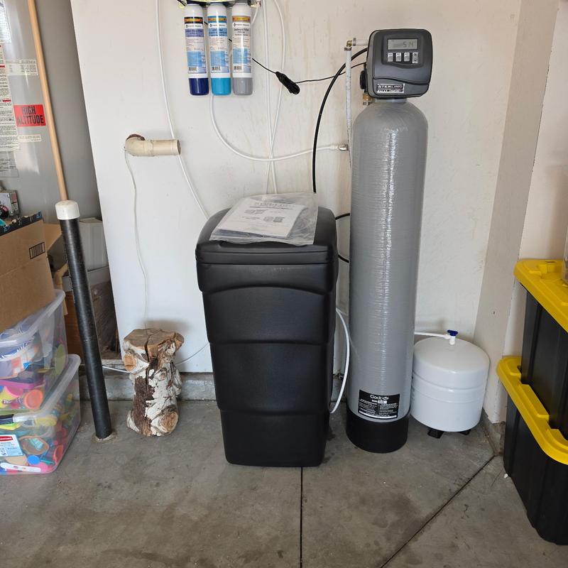 Water softener system with filtration setup in garage
