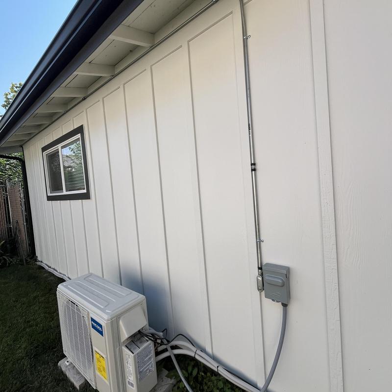 Mini split outdoor unit with electrical conduit setup Mini split outdoor unit with electrical conduit setup