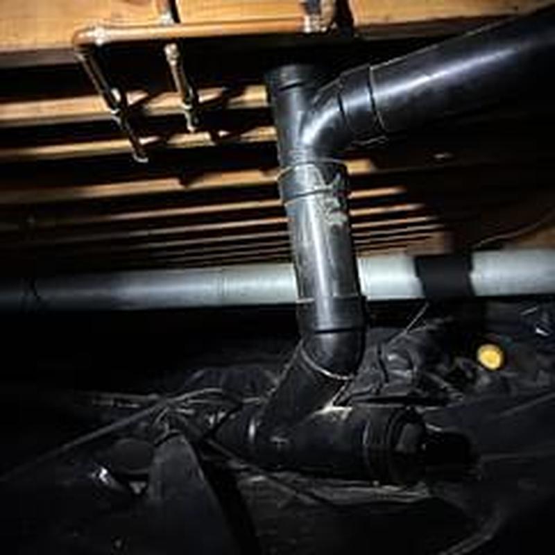 Sewer line cleanout pipe in crawlspace inspection
